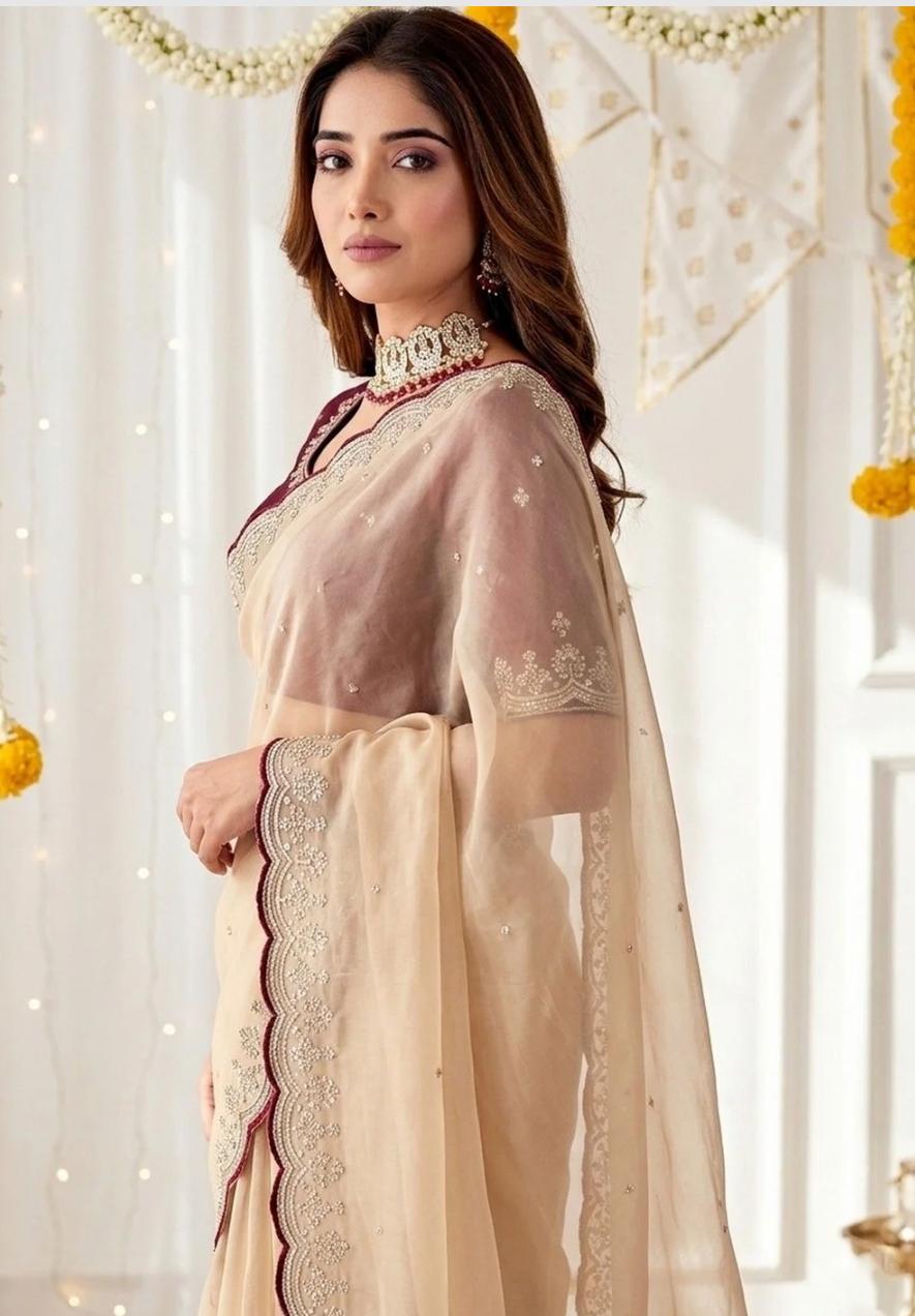 Sophisticated Beige Organza Saree with Delicate Silver Embroidered Cutwork